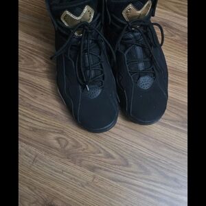 Jordan Black Sneakers with Gold Tongue Accent